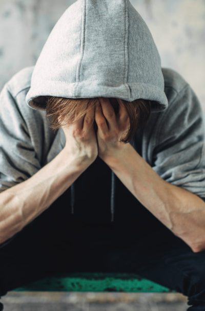 Junkie sitting on the bed, withdrawal symptom Junkie sitting on the bed, withdrawal symptom